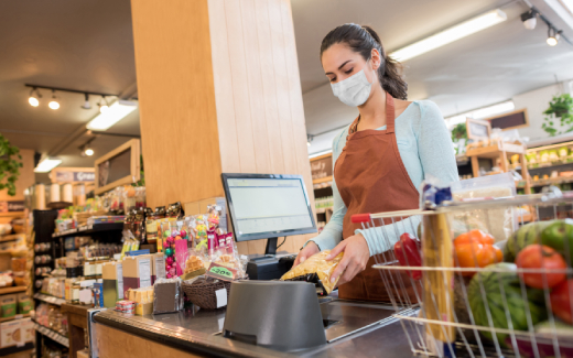 Grocery Store Clerk Cashes Customer Out