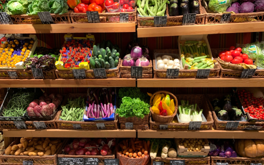 Wall of Produce inside of a grocery store